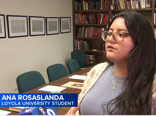 student speaking to the news in an archive room